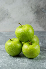 Bunch of fresh apples on marble background