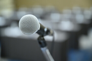 Microphone over the blurred business people forum Meeting Conference Training Learning Coaching...