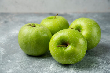 Bunch of fresh apples on marble background