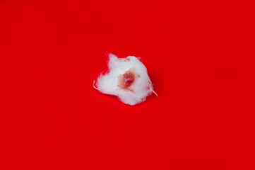 Cotton wool on red background.Popular in the medical field.