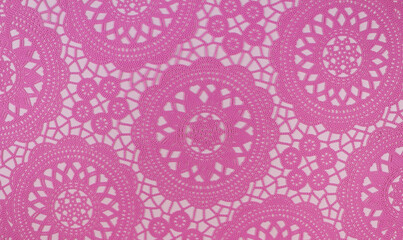 Pink openwork napkin on a white background