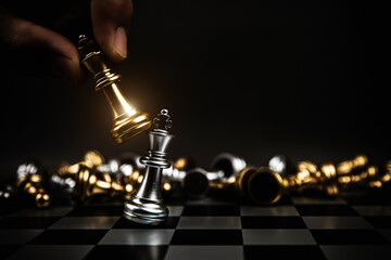 Close up hand choose king chess to challenge battle fighting on chess board concepts of leadership...