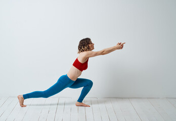 Woman doing gymnastics exercises yoga asana sportswear