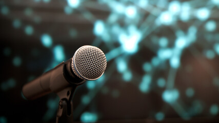 Public speaking backgrounds, Close-up the microphone on stand for speaker speech presentation stage performance with blur and bokeh light background.