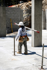 Construction working carrying tools