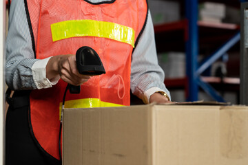 Warehouse worker using barcode scanner in storehouse . Logistics , supply chain and warehouse...