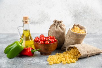 Pastas in rustic bags served with cherry tomatoes, chilies and olive oil