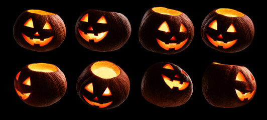 Naklejka premium A set of glowing pumpkins. Isolated on a black background