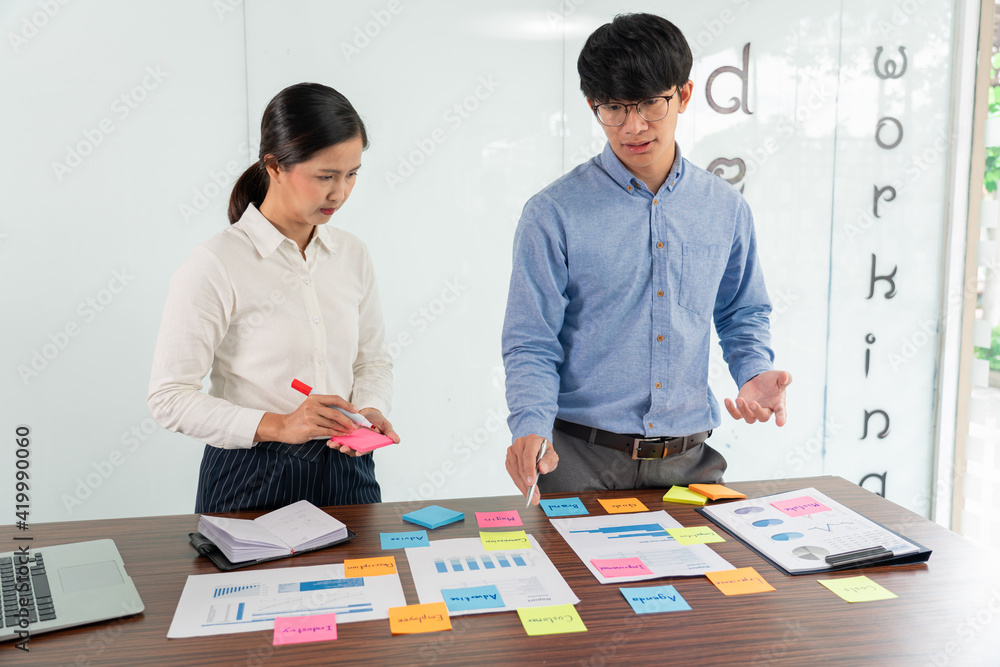 Poster businessman stick colorful notes to brainstorming on the table working on new project to share idea 