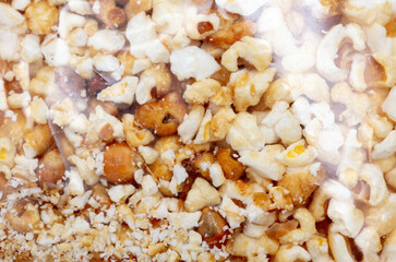 Popcorn in a plastic bag as a background.