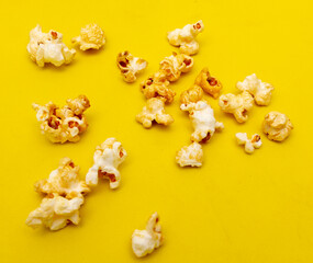 Obraz na płótnie Canvas Close-up of popcorn on a yellow background.