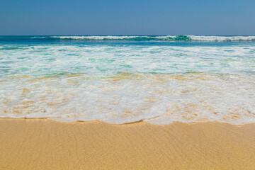 Fototapeta na wymiar Sea view from tropical beach with sunny sky in Bali.