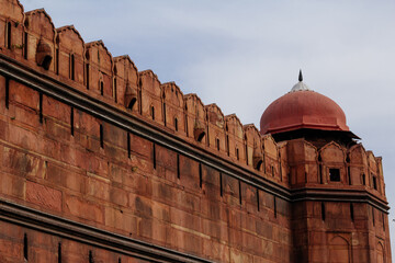 Fototapeta na wymiar India travel tourism background - Red Fort (Lal Qila) Delhi - World Heritage Site. Inside view of the Red Fort, ancient tower of red stone in the fortress the dom