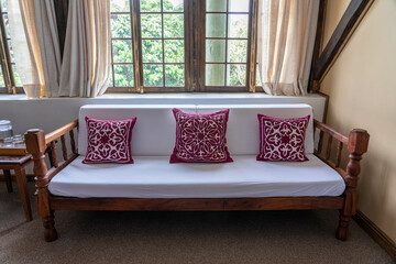 White sofa with red pillows in the living room