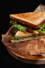 Breakfast sandwich on a black background