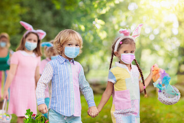 Family with kids on Easter egg hunt