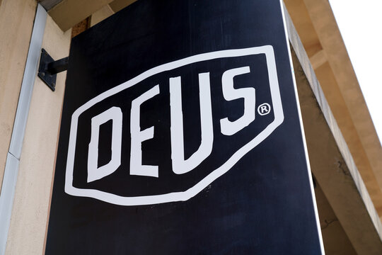 Deus Ex Machina logo text and brand sign fashion boutique clothes bike skate fun trendy concept shop