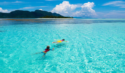 Kids snorkel. Children snorkeling in tropical sea.