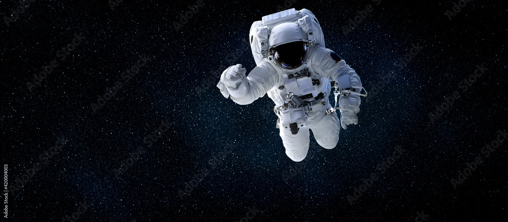 Wall mural astronaut spaceman do spacewalk while working for space station in outer space . astronaut wear full