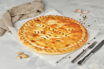 Ossetian pie with meat on light background