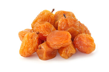Pile dried tasty yellow plums isolated on white