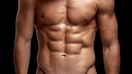 Fotobehang Closeup image of a strong athletic man showing muscular body and sixpack abs isolated black background. © Dragosh