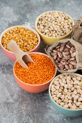 Assortment of raw dry legumes composition on marble surface
