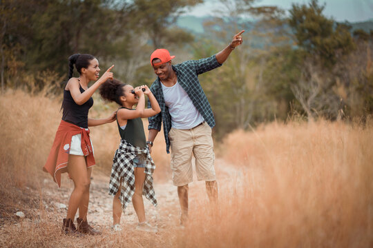 Family Black People Having Fun In The Park. Family Holiday And Camping  Adventure Activity. 