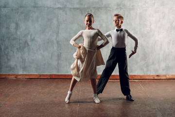 Young dancers boy and girl dancing in ballroom dance Samba