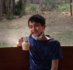 Fototapeta premium child drinking ice coffee