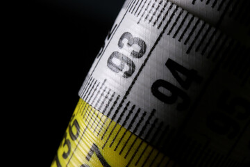 measuring tape on a black background