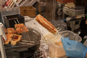 Glazed surimi as street food in Osaka.