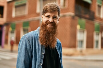 Young irish hipster man smiling happy standing at the city.