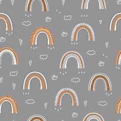 Seamless pattern with a cute rainbow.