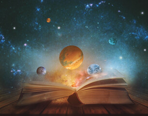 Book of the universe - opened magic book with planets and galaxies. Elements of this image...