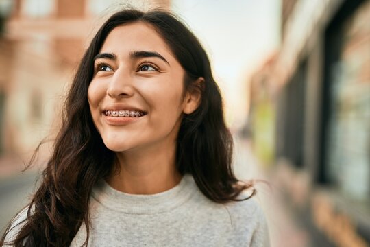 Young middle east girl smiling happy standing at the city.
