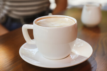Aromatic coffee on wooden table outdoors, closeup