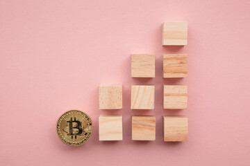 Bitcoin cryptocurrency coin blockchain technology concept. Coin with wood block