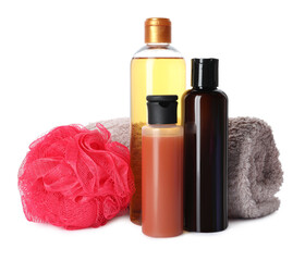 Personal hygiene products with towel and shower puff on white background