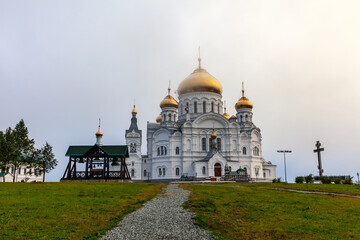 Fototapeta na wymiar Foggy morning. Holy Cross Cathedral on Belaya Gora