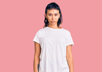 Obraz premium Young woman wearing casual clothes depressed and worry for distress, crying angry and afraid. sad expression.