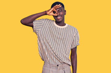 Young african american man wearing casual clothes puffing cheeks with funny face. mouth inflated with air, crazy expression.