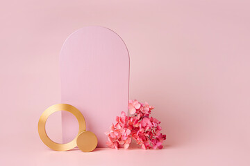 Pink arch and golden rounds with flowers on a pink background.  Stylish  background with geometric shapes for cosmetic product presentation - obrazy, fototapety, plakaty