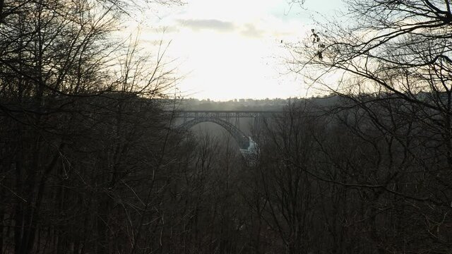 [4k] railroad bridge M&uuml;ngstener Br&uuml;cke in sunset between trees