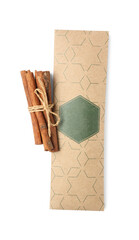 Scented sachet and cinnamon on white background, top view