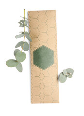 Scented sachet and eucalyptus branches on white background, top view