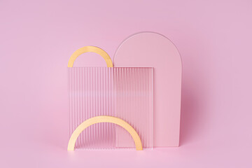 Ribbed acrylic plate with gold arches on a pastel pink background. Stylish background with various materials and geometric shapes