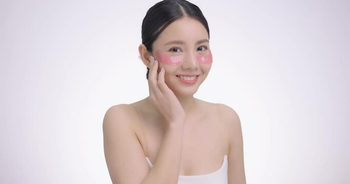 Cosmetic Eye Mask. Close Up Beauty Face Asian Woman With Fresh Clean Skin Using Eye Pad, Eye Care Treatment. Beauty And Skin Care Concept.