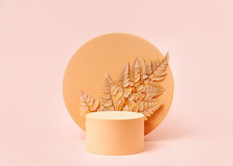 Podium with leaf and circle to show cosmetic products. Monochrome beige color background for...