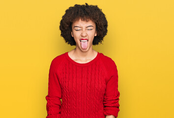 Fototapeta na wymiar Young hispanic girl wearing casual clothes sticking tongue out happy with funny expression. emotion concept.